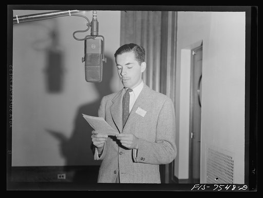 Washington, D.C. Foreign students at the international student sssembly recording short talks in their native language to be broadcast by shortwave, after censorship by the Office of War Information (OWI), to Nazi-held territory. Hernando Groot of Colombia