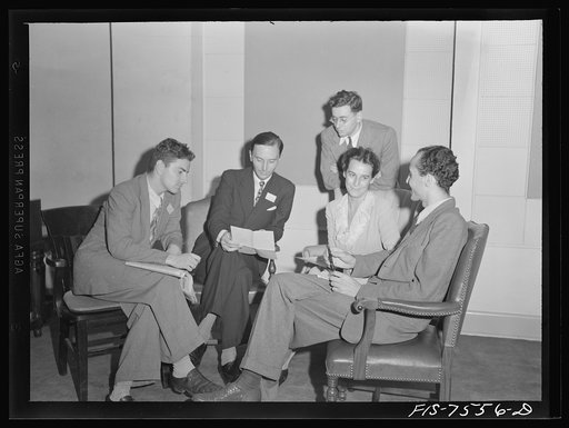 Untitled photo, possibly related to: Washington, D.C. Foreign students at the international student assembly recording short talks in their native language to be broadcast by shortwave, after censorship by the Office of War Information (OWI), to Nazi-held territory. An Italian group discussing the w