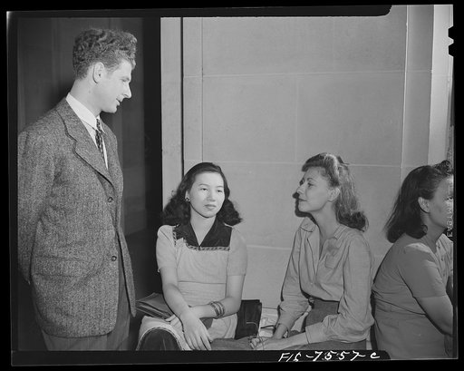Washington, D.C. International student assembly. American-born Chinese girl and other students chatting between sessions