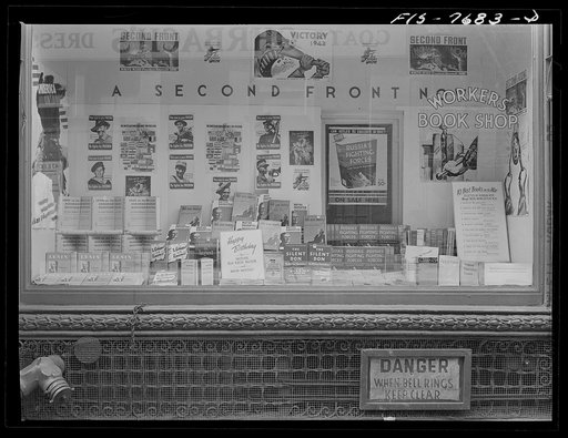 New York, New York. Workers' bookshop in a building on 13th Street between University Place and Broadway, which is the headquarters of the Communist party. No mention of Communism appears in the display or on the building