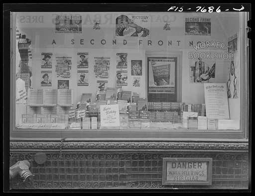 Untitled photo, possibly related to: New York, New York. Workers' bookshop in a building on 13th Street between University Place and Broadway, which is the headquarters of the Communist party. No mention of Communism appears in the display or on the building