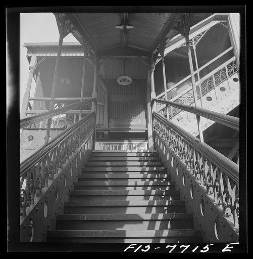 Untitled photo, possibly related to: New York, New York. Third Ave elevated railway steps at the 94th Street Station in the early morning