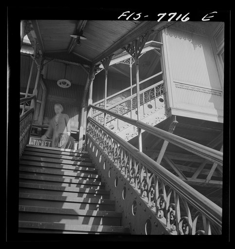 Untitled photo, possibly related to: New York, New York. Third Ave elevated railway steps at the 94th Street Station in the early morning