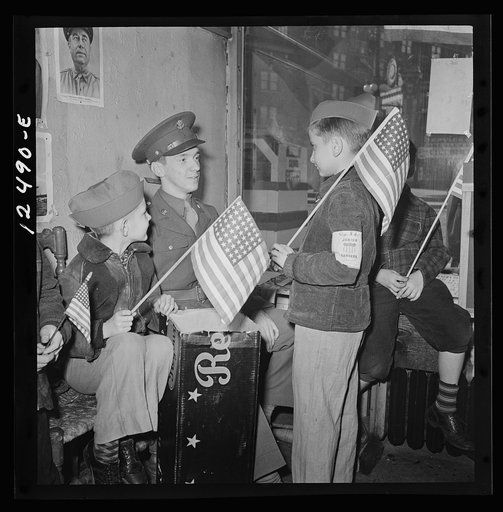 Chicago (north), Illinois. Junior Rangers talking things over with Private W.J. Miller. They all took part in a flag dedication ceremony in their block