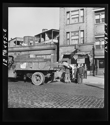 Untitled photo, possibly related to: Chicago (north), Illinois. On Armistice Day, a city-wide scrap collection drive was held. Trucks were lent by city and private truckers, and services were donated by members of the Teamster's union