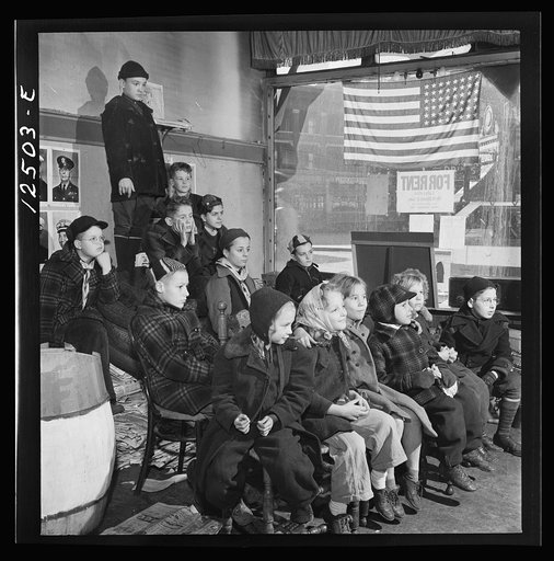 Chicago (north), Illinois. Children assembled in Office of Civilian Defense headquarters for a pep talk on the need of bringing in more scrap