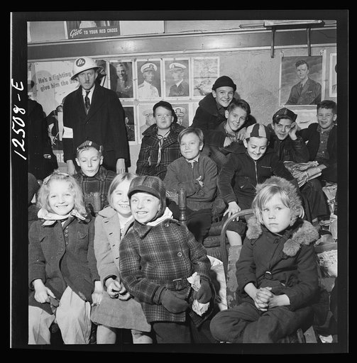 Chicago (north), Illinois. Children assembled in Office of Civilian Defense headquarters for a pep talk on the need of bringing in more scrap