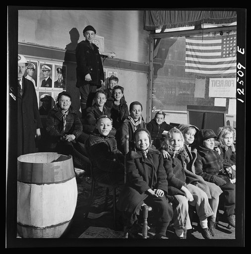 Untitled photo, possibly related to: Chicago (north), Illinois. Children assembled in Office of Civilian Defense headquarters for a pep talk on the need of bringing in more scrap
