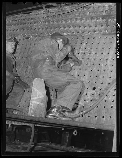 Chicago, Illinois. Reconditioning the firebox of a locomotive at the Chicago and Northwestern Railroad shops