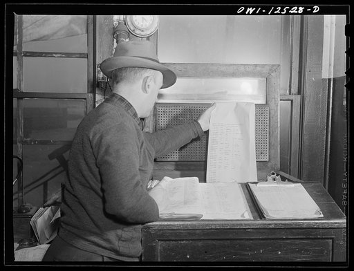 Chicago, Illinois. Switch lists coming in by teletype to the hump offices at a Chicago and Northwestern Railroad yard