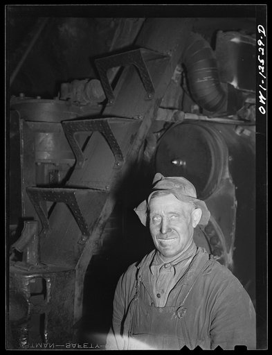Chicago, Illinois. Worker at the roundhouse at a Chicago and Northwestern Railroad yard