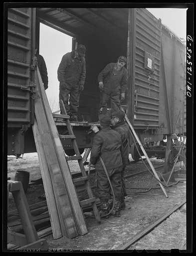Chicago, Illinois. Workmen repairing a freight car on the "rip" tracks at a Chicago and Northwestern Railroad yard