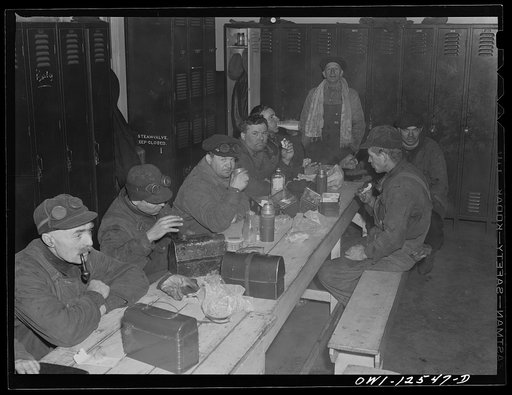 Chicago, Illinois. Chicago and Northwestern Railroad workmen having their lunch in a shanty at the repair tracks