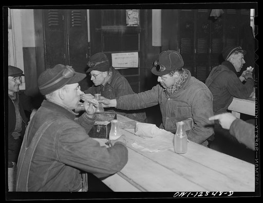 Untitled photo, possibly related to: Chicago, Illinois. Chicago and Northwestern Railroad workmen having their lunch in a shanty at the repair tracks