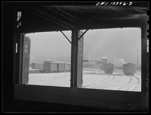Chicago, Illinois. Looking out toward the icehouse from the freighthouse at a yard of the Chicago and Northwestern Railroad
