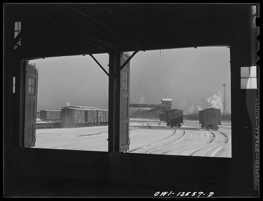 Untitled photo, possibly related to: Chicago, Illinois. Looking out toward the icehouse from the freighthouse at a yard of the Chicago and Northwestern Railroad