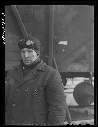 Chicago, Illinois. A welder employed at the repair tracks at a yard of the Chicago and Northwestern Railroad