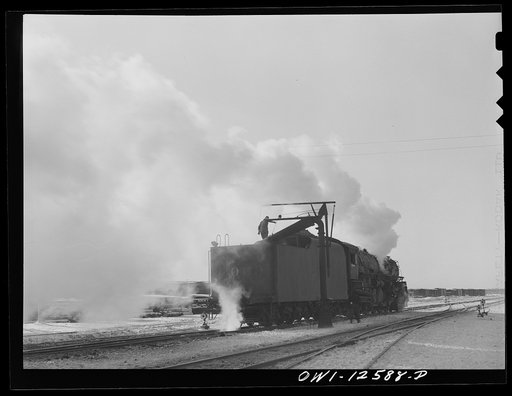 Chicago, Illinois. Engine taking on water before going out on the road at a yard of the Chicago and Northwestern Railroad