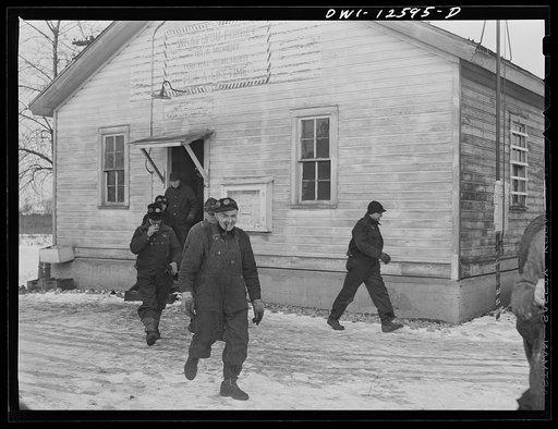 Chicago, Illinois. Workmen on the repair tracks on the Chicago and Northwestern Railroad coming out of their lunch room
