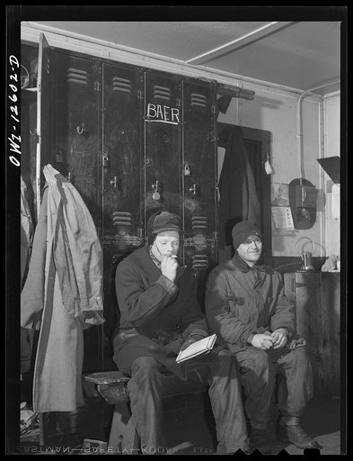 Chicago, Illinois. Switchmen resting between trains in the yard office in a Chicago and Northwestern Railroad yard