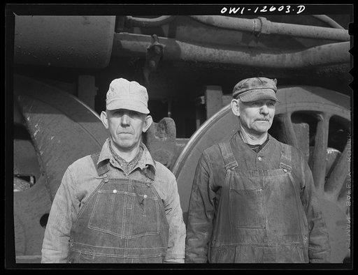 Chicago, Illinois. Engineer and fireman on a regular run, at a yard of the Chicago and Northwestern Railroad