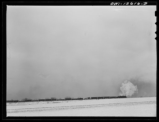 Chicago, Illinois. Freight train pulling out of one of the yards of the Chicago and Northwestern Railroad