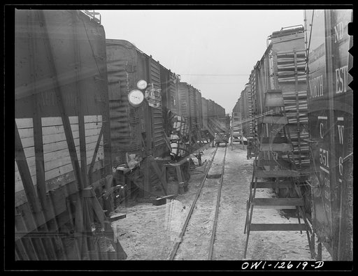 Untitled photo, possibly related to: Chicago, Illinois. View down one of the repair tracks at a yard of the Chicago and Northwestern Railroad