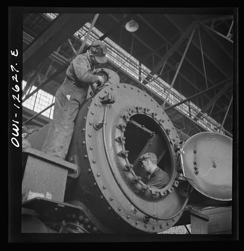 Chicago, Illinois. Working on a locomotive at the Chicago and Northwestern Railroad repair shops