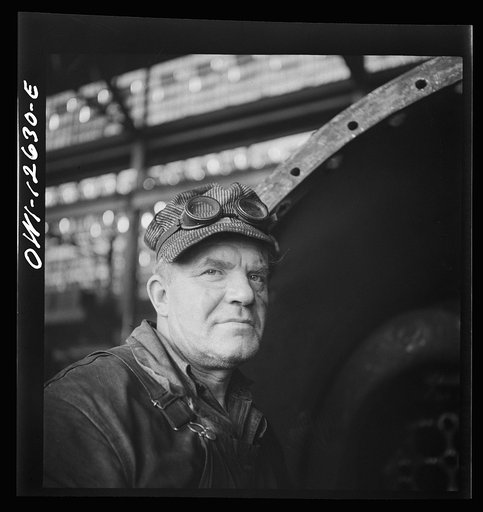 Chicago, Illinois. A welder's helper at a Chicago and Northwestern Railroad repair shop