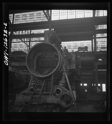 Untitled photo, possibly related to: Chicago, Illinois. In the Chicago and Northwestern locomotive repair shop
