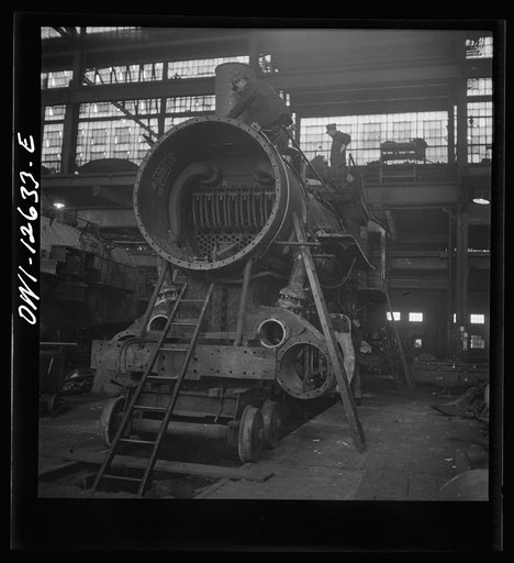 Untitled photo, possibly related to: Chicago, Illinois. In the Chicago and Northwestern locomotive repair shop