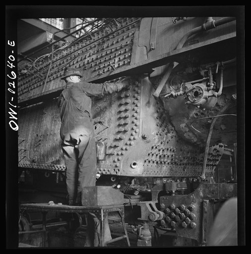 Untitled photo, possibly related to: Chicago, Illinois. In the Chicago and Northwestern locomotive repair shop