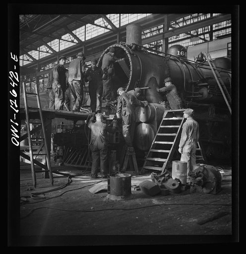 Chicago, Illinois. Working on a locomotive at the Chicago and Northwestern Railroad repair shop
