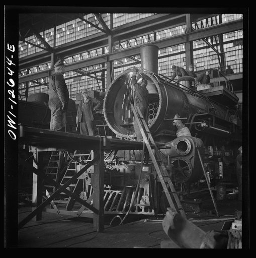 Chicago, Illinois. Working on a locomotive at the Chicago and Northwestern Railroad shops