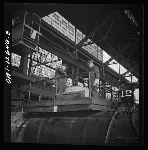 Chicago, Illinois. Working on a locomotive at the Chicago and Northwestern Railroad shops