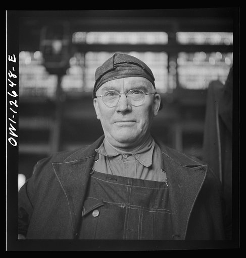 Chicago, Illinois. A welder at the Chicago and Northwestern Railroad repair shops