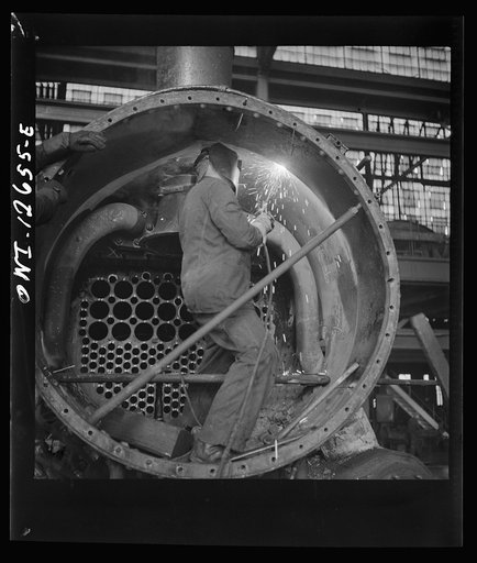 Chicago, Illinois. Working on a locomotive at the Chicago and Northwestern Railroad shops