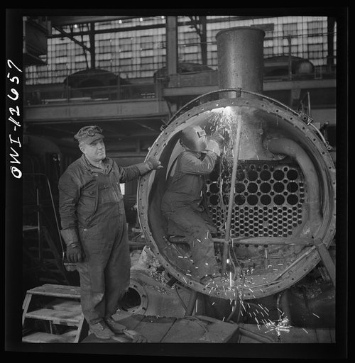 Chicago, Illinois. Working on a locomotive at the Chicago and Northwestern Railroad shops