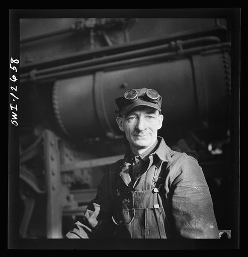 Chicago, Illinois. A worker in the Chicago and Northwestern Railroad locomotive repair shops