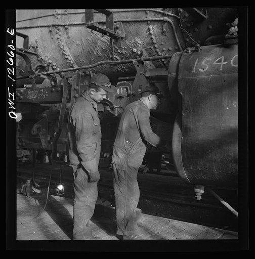 Untitled photo, possibly related to: Chicago, Illinois. In the Chicago and Northwestern Railroad locomotive repair shops
