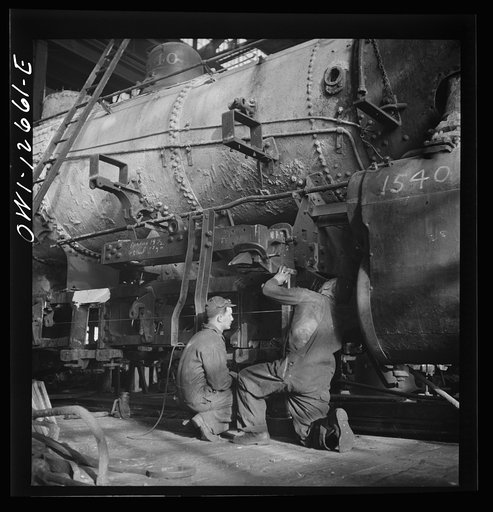 Untitled photo, possibly related to: Chicago, Illinois. In the Chicago and Northwestern Railroad locomotive repair shops