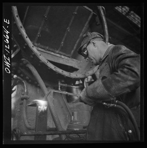 Chicago, Illinois. Cutting a metal part for a locomotive at the Chicago and Northwestern Railroad repair shops