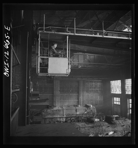 Chicago, Illinois. Crane operator at the Chicago and Northwestern Railroad repair shops