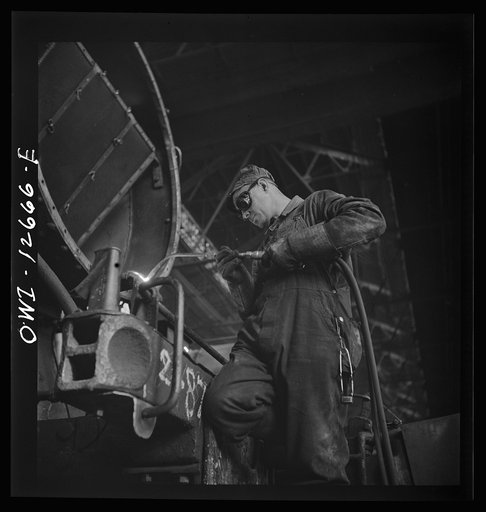 Chicago, Illinois. Cutting a metal part for a locomotive at the Chicago and Northwestern Railroad repair shops