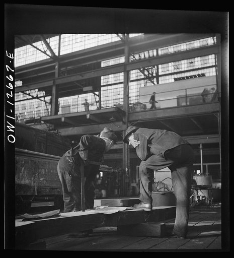 Chicago, Illinois. Workmen studying blueprints in the Chicago and Northwestern Railroad repair shops