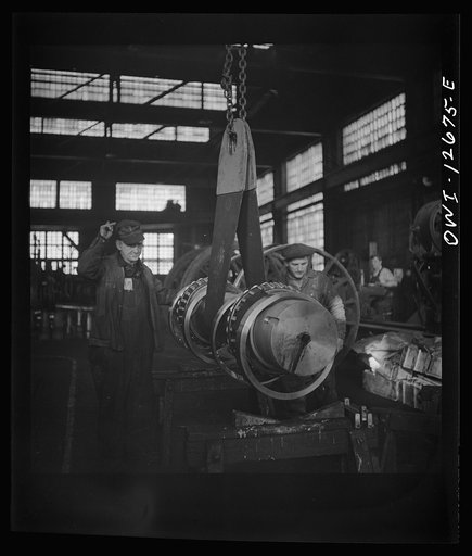 Untitled photo, possibly related to: Chicago, Illinois. Refacing a wheel in the Chicago and Northwestern Railroad wheel shop