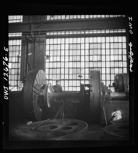 Chicago, Illinois. Refacing a wheel in the Chicago and Northwestern Railroad wheel shop