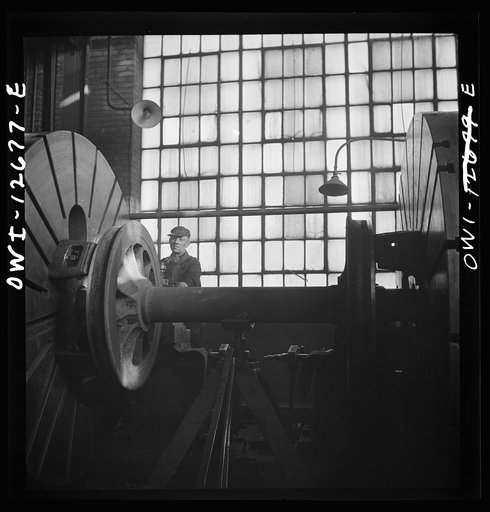 Chicago, Illinois. Refacing a wheel in the Chicago and Northwestern Railroad wheel shop
