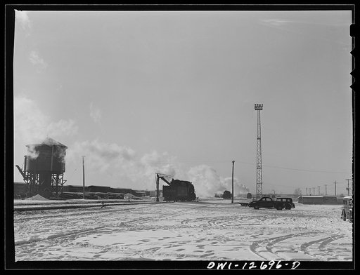 Chicago, Illinois, Engine taking on water at a Chicago and Northwestern Railroad yard