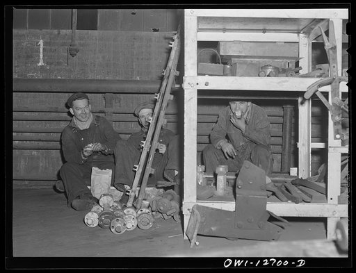 Untitled photo, possibly related to: Chicago, Illinois. Workmen at the Chicago and Northwestern Railroad's locomotive shops during their half-hour lunch period